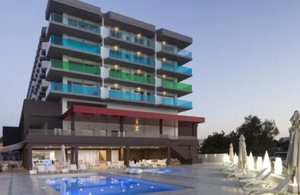 AxelBeach Ibiza Suites, an adults-only gay-friendly hotel. Poolside view of the apartments, spa, and beach club. Perfect for gay travel.