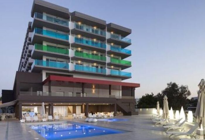 AxelBeach Ibiza Suites, an adults-only gay-friendly hotel. Poolside view of the apartments, spa, and beach club. Perfect for gay travel.