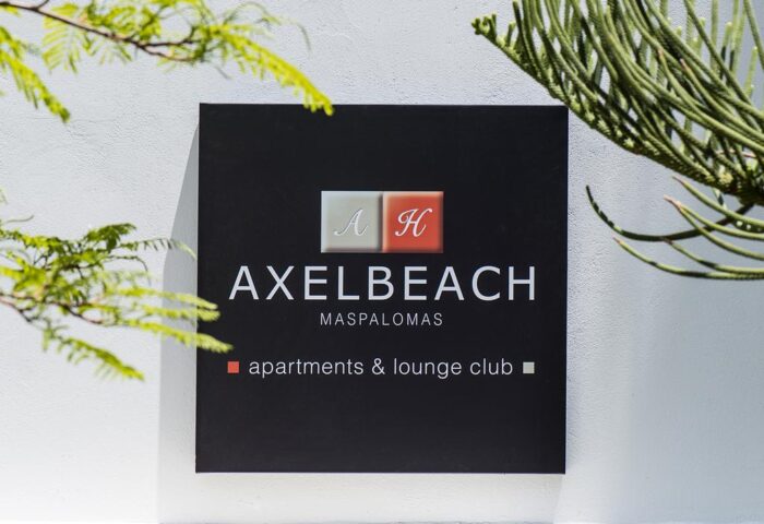 Sign for AxelBeach Maspalomas, a gay-friendly, adults-only apart & lounge club. Hotel in Gran Canaria, Spain. Travel destination.