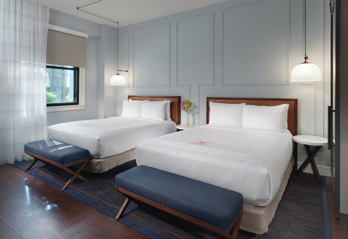 Axiom Hotel room with two beds. Gay-friendly hotel with modern design. Comfortable stay for gay travelers. Interior of room in hotel.