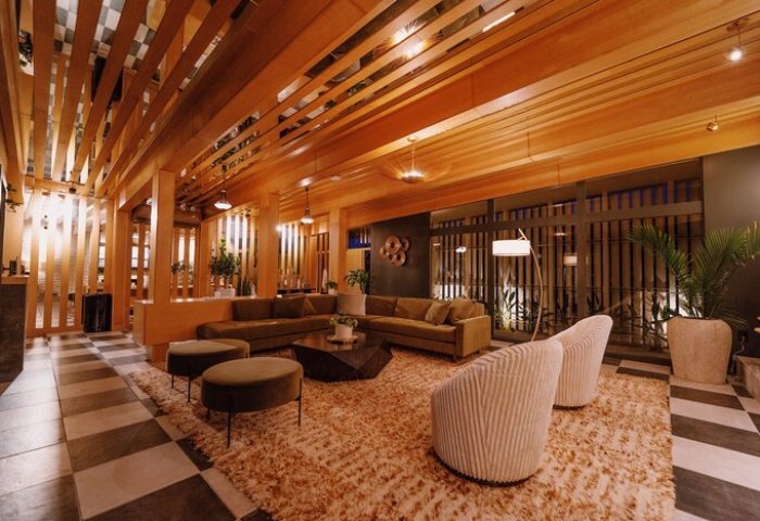 Azure Sky Hotel Adults Only lobby. Gay-friendly hotel lounge area with modern design, wood accents, and comfortable seating. Perfect for gay travelers.