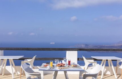 Breakfast with a view at Azzurro Suites, a gay-friendly hotel. Enjoy the sea view from the terrace. Gay travel in style.