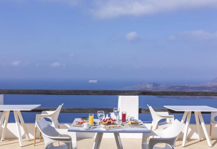 Breakfast with a view at Azzurro Suites, a gay-friendly hotel. Enjoy the sea view from the terrace. Gay travel in style.