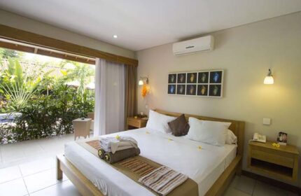 Balinea Villa & Spa gay-friendly hotel room. King bed, patio view, tropical garden. Gay travel luxury accommodation.