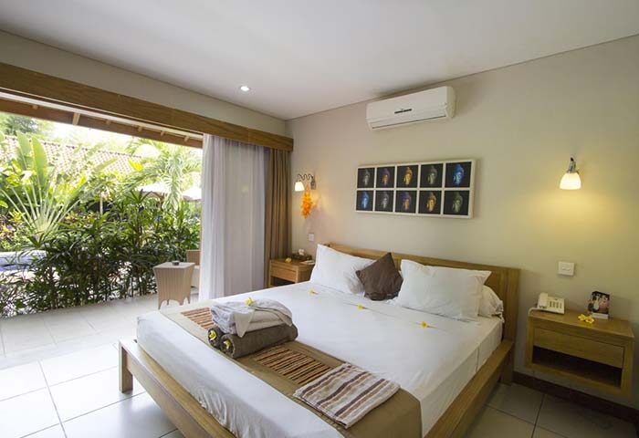 Balinea Villa & Spa gay-friendly hotel room. King bed, patio view, tropical garden. Gay travel luxury accommodation.