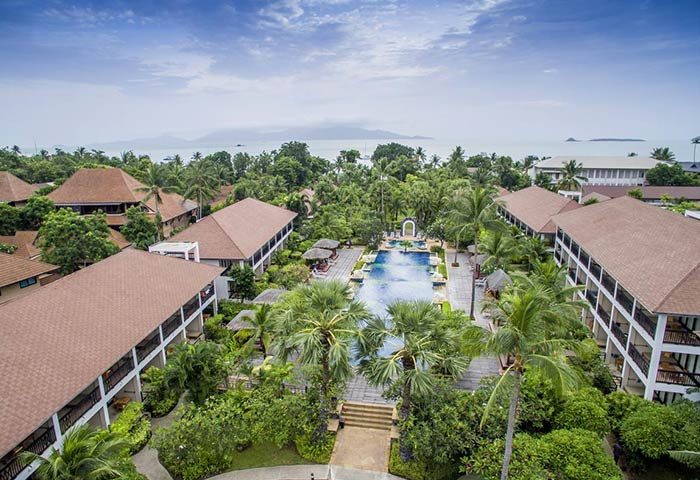 Aerial view of Bandara Resort & Spa, a gay-friendly hotel. Lush greenery surrounds buildings and a pool. Perfect for gay travel.