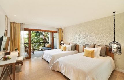 Bandara Resort & Spa gay-friendly hotel room with two beds and balcony. Tropical decor, ideal for gay travel and relaxation.
