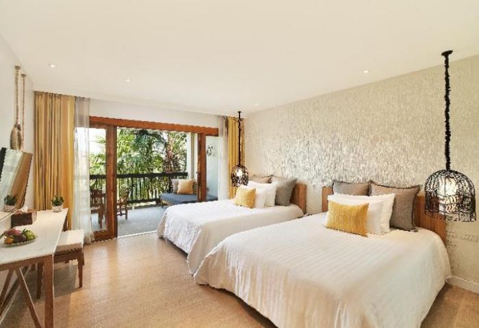 Bandara Resort & Spa gay-friendly hotel room with two beds and balcony. Tropical decor, ideal for gay travel and relaxation.
