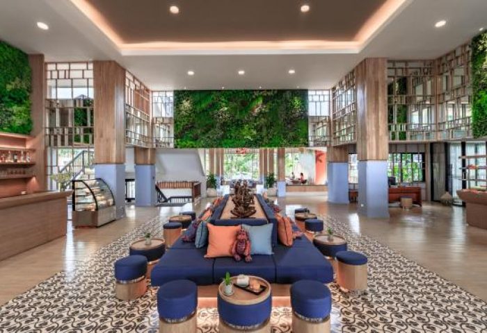 Bandara Resort & Spa lobby. Gay-friendly hotel features lush greenery, stylish seating, and a welcoming atmosphere for gay travelers.