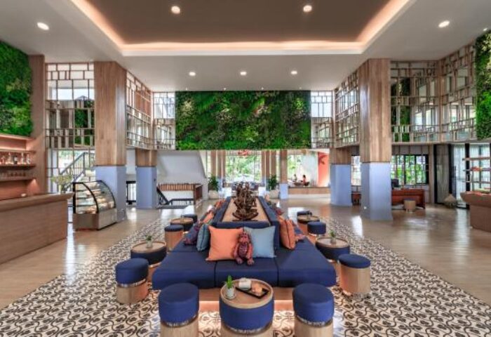 Bandara Resort & Spa lobby. Gay-friendly hotel features lush greenery, stylish seating, and a welcoming atmosphere for gay travelers.