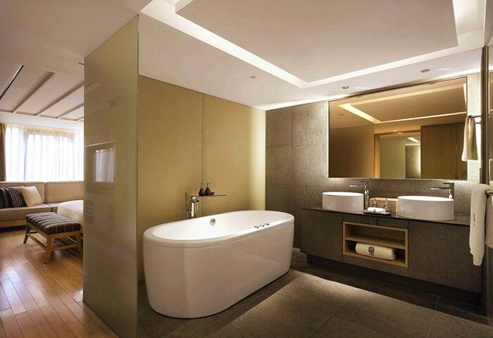 Banyan Tree Club & Spa Seoul gay-friendly hotel bathroom. Bathtub, double sinks, and modern design for gay men's travel in Seoul.