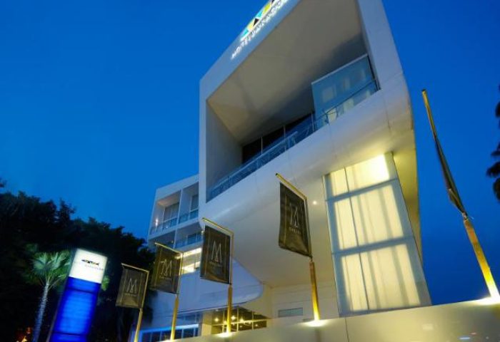 Baraquda Pattaya Mgallery exterior at night. Gay-friendly hotel with modern design. Ideal for gay men's travel in Pattaya, Thailand.