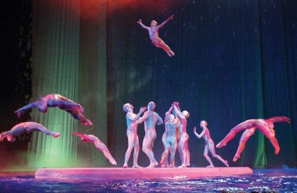 O show at gay-friendly Bellagio Hotel. Acrobats performing on stage. The Bellagio is a great hotel for gay men visiting Las Vegas.