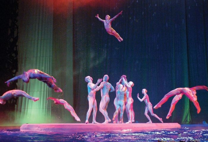O show at gay-friendly Bellagio Hotel. Acrobats performing on stage. The Bellagio is a great hotel for gay men visiting Las Vegas.