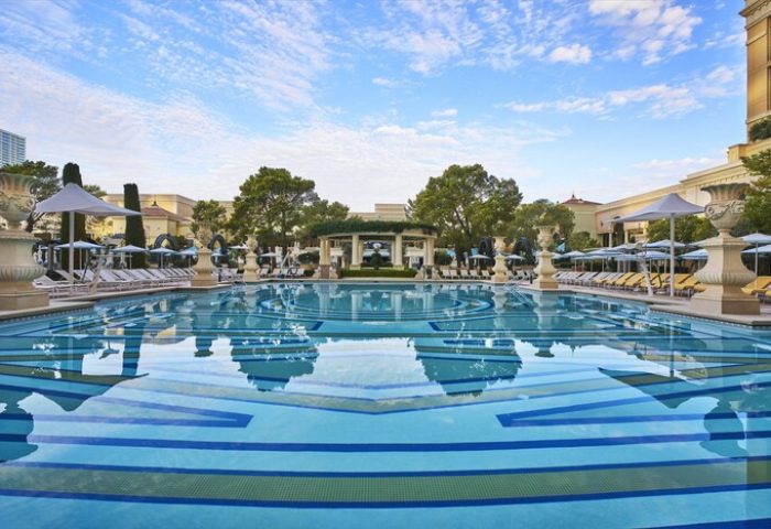 Bellagio Hotel pool, a gay-friendly hotel in Las Vegas. The pool features a beautiful design & lounge chairs. Great for gay travel.