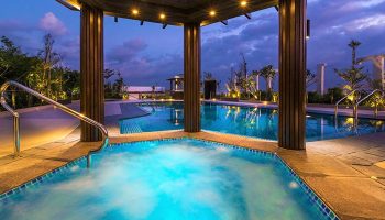 Belmont Hotel Manila's rooftop pool at dusk. This gay-friendly hotel offers a relaxing & luxurious experience for gay travelers.