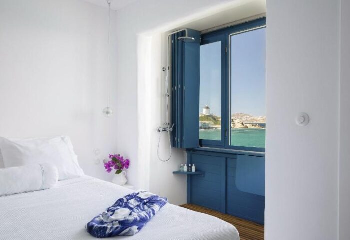 Belvedere Little Venice Pied-a-Terres gay-friendly hotel room with shower, bed, and sea view. Ideal for gay travelers seeking stylish accommodations.