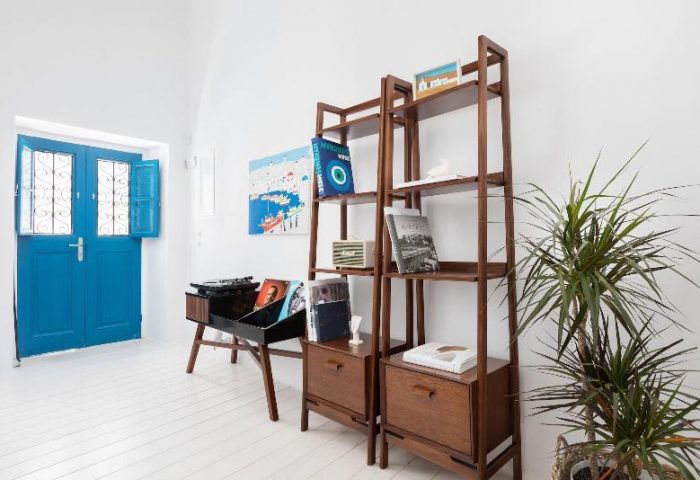 Belvedere Little Venice Pied-a-Terres interior. Blue door, record player, and wooden shelves. Gay-friendly hotel design elements.
