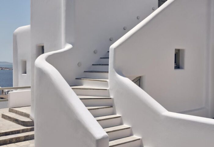 Staircase detail at Belvedere Mykonos Hilltop Complex, a gay-friendly hotel. Whitewashed walls and steps typical of Mykonos architecture.