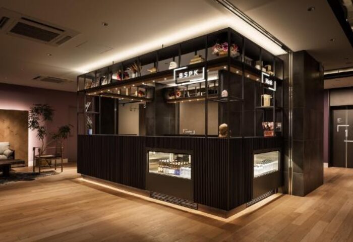 Bespoke Hotel Shinjuku lobby. Gay-friendly hotel with modern design, wooden floors, and stylish reception area. Ideal for gay travelers.