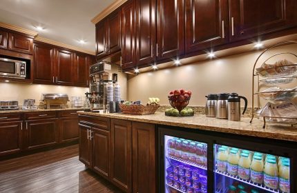 Breakfast bar at Best Western Plus Hawthorne Terrace Hotel, a gay-friendly hotel. Drinks, fruit, pastries, and coffee are available.
