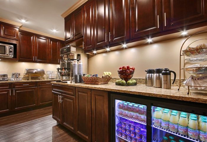 Breakfast bar at Best Western Plus Hawthorne Terrace Hotel, a gay-friendly hotel. Drinks, fruit, pastries, and coffee are available.
