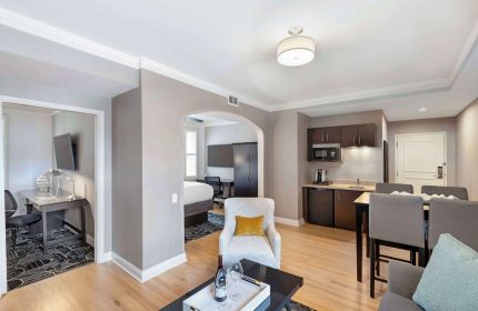 Best Western Plus Hawthorne Terrace Hotel's gay-friendly suite. Living area, kitchenette, bedroom, & workspace offer comfort.