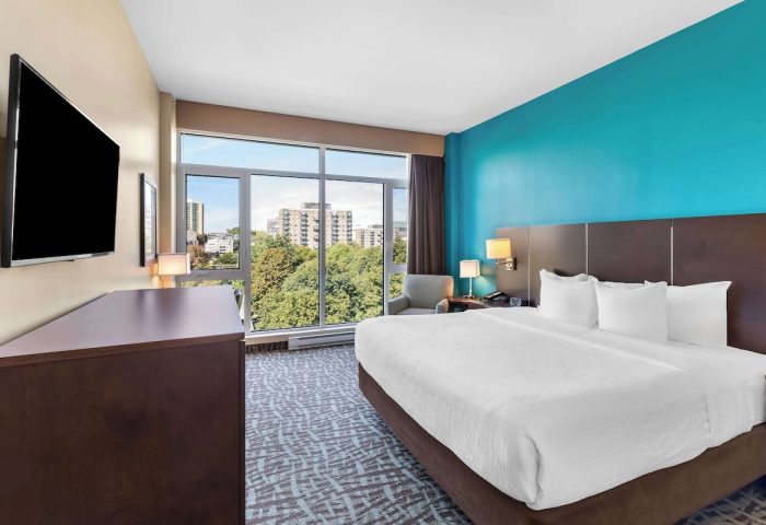 Best Western Plus Hotel Montreal guest room with a large window view. Gay-friendly hotel near Montreal's gay village.