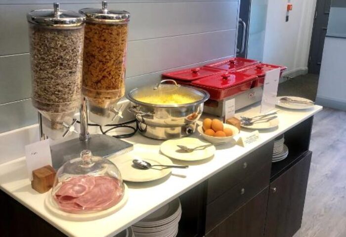 Breakfast buffet at Best Western Plus Vauxhall Hotel, a gay-friendly hotel. Cereal, scrambled eggs, ham, and other options are available.