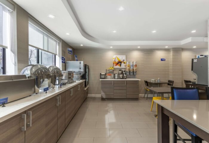 Best Western Red Coach Inn's breakfast bar. Gay-friendly hotel with buffet, cereal, coffee, and seating area. A great start to your day!