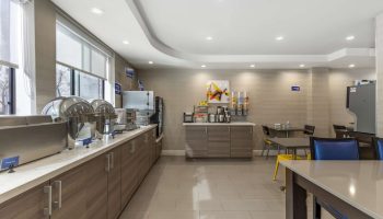 Best Western Red Coach Inn's breakfast bar. Gay-friendly hotel with buffet, cereal, coffee, and seating area. A great start to your day!