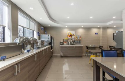 Best Western Red Coach Inn's breakfast bar. Gay-friendly hotel with buffet, cereal, coffee, and seating area. A great start to your day!