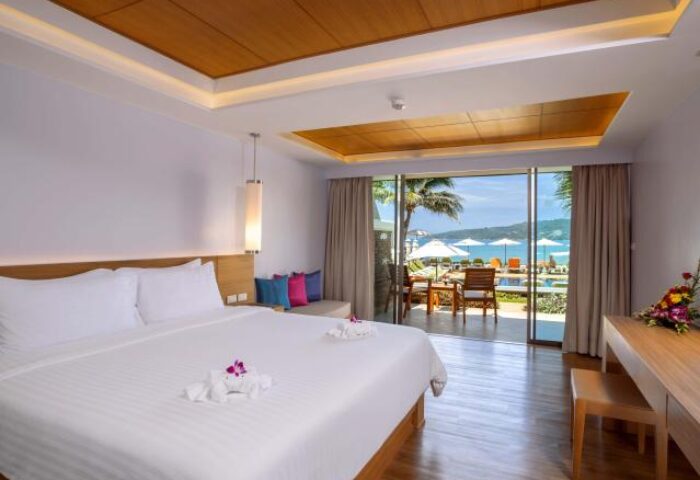 Beyond Resort Karon gay-friendly hotel room. King bed, ocean view, and balcony. Ideal for gay travelers seeking a relaxing Phuket vacation.