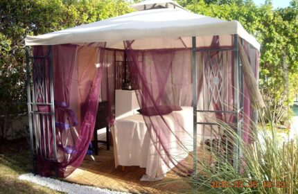 Outdoor massage gazebo at Birdcage Gay Men Resort & Lifestyle Hotel. Relaxing spa area for gay travel, wellness, and lifestyle.