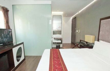 Bliss Hotel Singapore room. Gay-friendly hotel room with bed, TV, and bathroom. Modern design for gay travelers. Singapore hotel room.