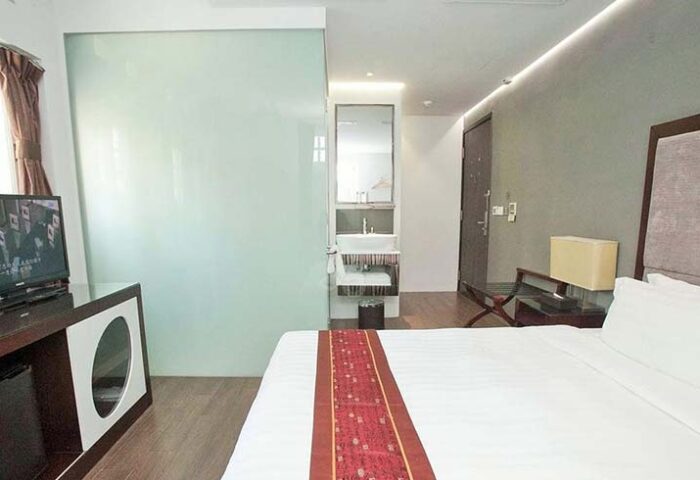 Bliss Hotel Singapore room. Gay-friendly hotel room with bed, TV, and bathroom. Modern design for gay travelers. Singapore hotel room.