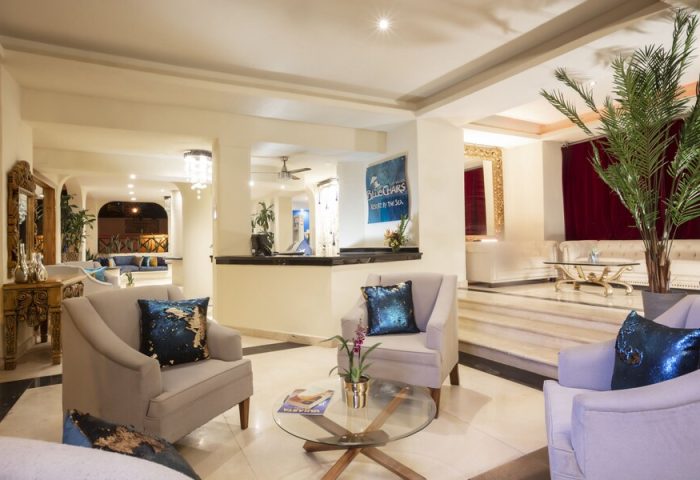 Lobby at Blue Chairs Resort by the Sea, a gay-friendly, adults-only hotel. Stylish seating area. Ideal for gay men's vacation.