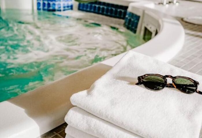 Blue Horizon Hotel's spa: towels and sunglasses by the jacuzzi. Gay-friendly hotel advice for gay men, travel tips, and vacation planning.