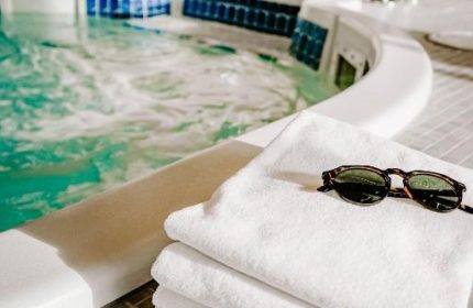 Blue Horizon Hotel's spa: towels and sunglasses by the jacuzzi. Gay-friendly hotel advice for gay men, travel tips, and vacation planning.