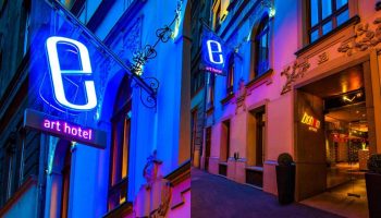 Bohem Art Hotel, a gay-friendly hotel. Exterior view at night with neon sign. A great choice for gay men travel.