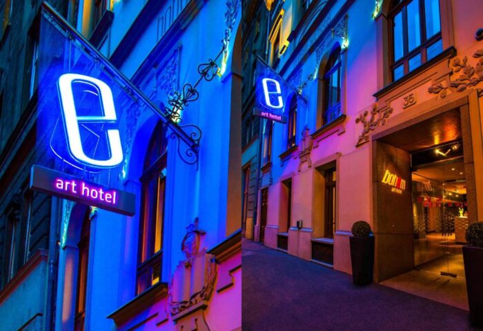 Bohem Art Hotel, a gay-friendly hotel. Exterior view at night with neon sign. A great choice for gay men travel.