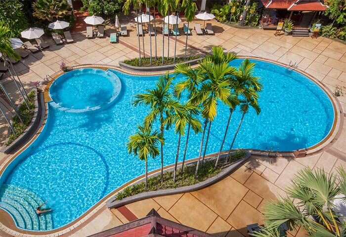 Aerial view of the pool at Gay-Friendly Borei Angkor Resort & Spa, a luxurious hotel for gay men in Siem Reap, Cambodia.