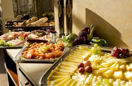 Gay-friendly Boutique Hotel Seven Days food buffet. Cheese, salmon, bread, and charcuterie selection. A delicious spread for a great stay.