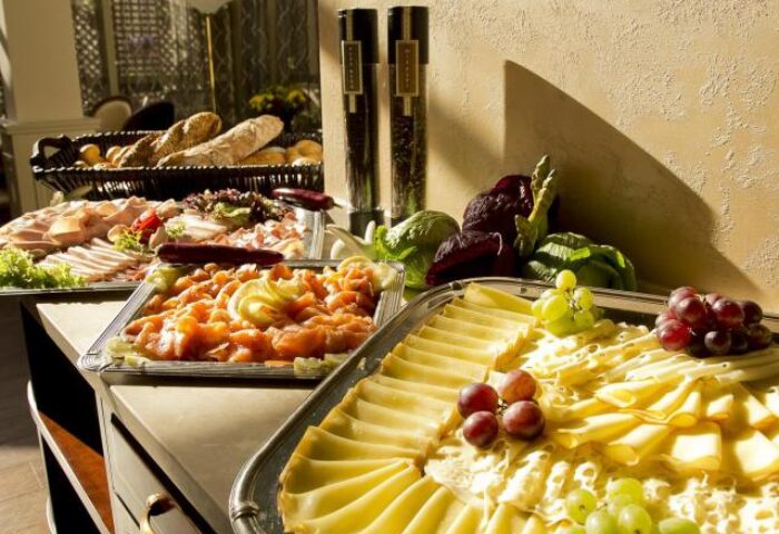 Gay-friendly Boutique Hotel Seven Days food buffet. Cheese, salmon, bread, and charcuterie selection. A delicious spread for a great stay.