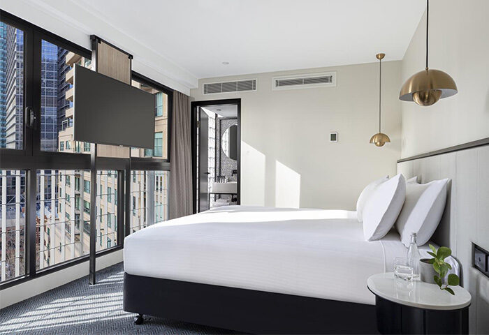 Brady Hotels Jones Lane guest room. Modern gay-friendly hotel room with city view, TV, and ensuite bathroom. Ideal for gay men travel.