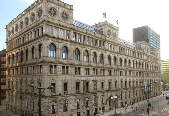 Britannia Manchester Hotel: Gay-friendly hotel in Manchester's city center. Large, ornate building with arched windows and detailed stonework.