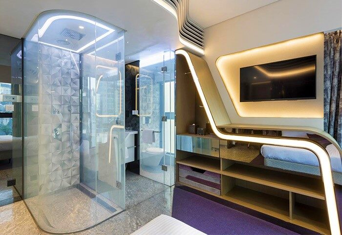 LKF Boutique Hotel Central room. Modern design with glass shower, open bathroom, and sleek shelving. Gay-friendly hotel in Central, Hong Kong.