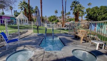 CCBC Resort Hotel hot tubs, a gay men's resort. Outdoor jacuzzi area with palm trees. Gay-friendly hotel with relaxing amenities.