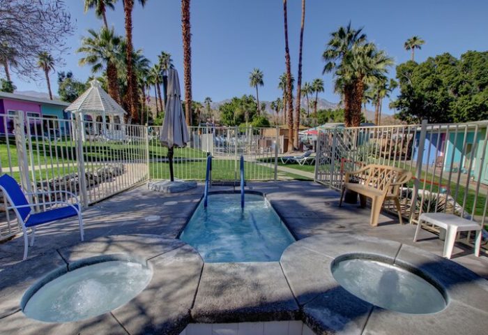 CCBC Resort Hotel hot tubs, a gay men's resort. Outdoor jacuzzi area with palm trees. Gay-friendly hotel with relaxing amenities.
