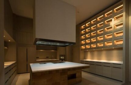 CHAO Sanlitun Beijing hotel kitchen. Gay-friendly hotel kitchen with island, hood, and unique wall storage. Modern design in Beijing, China.